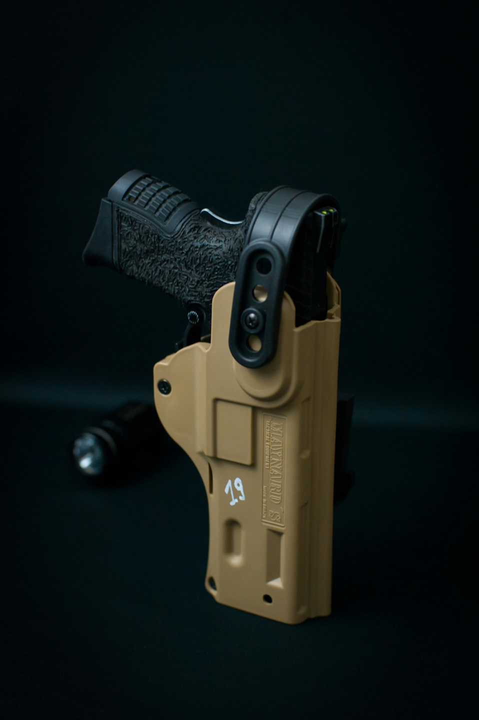 Image of a holstered handgun for gun shop near me