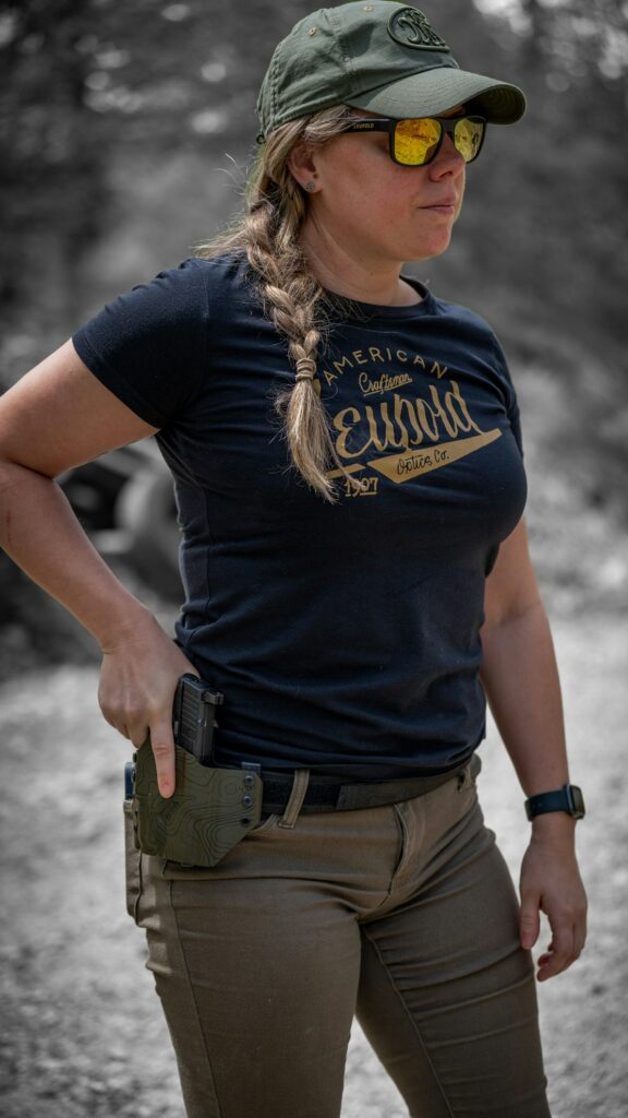 Image of a woman practicing gun safety for concealled carry course in Albuquerque